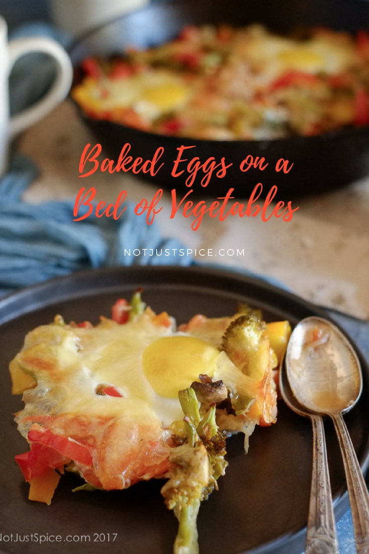 Baked Eggs on a Bed of Vegetables on notjustspice.com