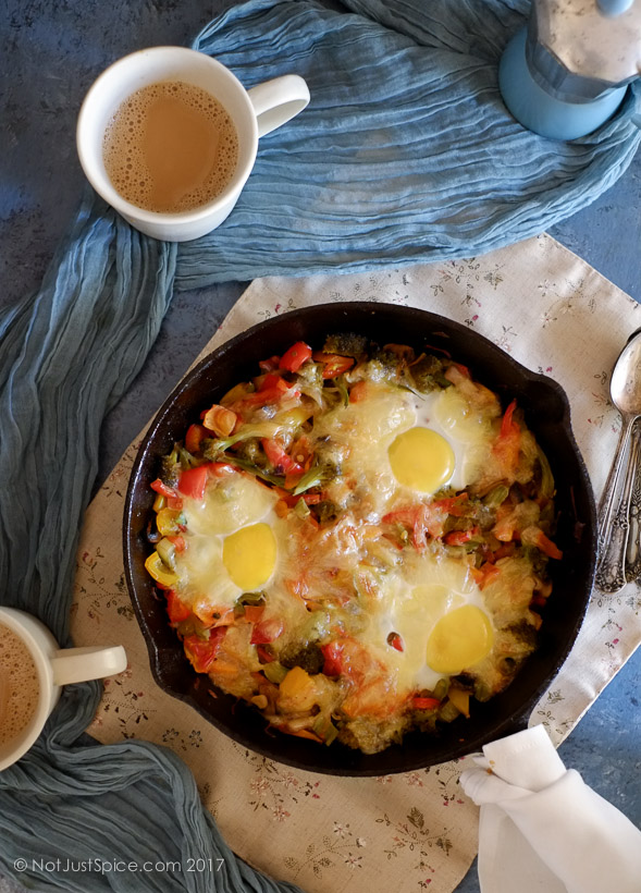 Baked Eggs on a Bed of Vegetables on notjustspice.com