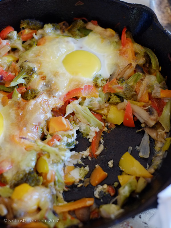 Baked Eggs on a Bed of Vegetables on notjustspice.com
