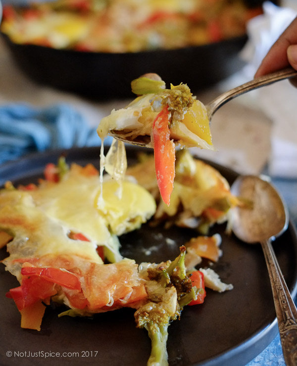 Baked Eggs on a Bed of Vegetables on notjustspice.com