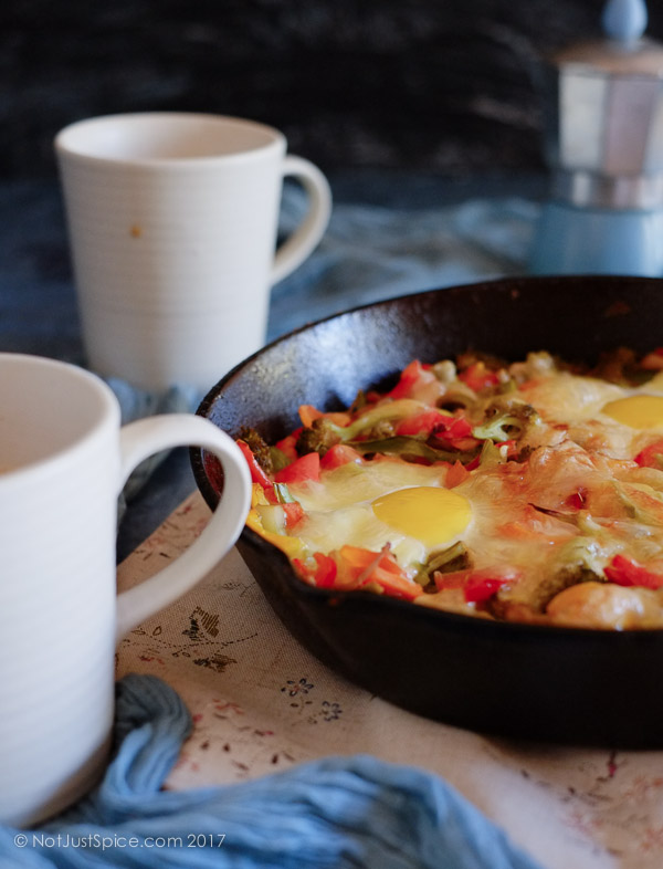 Baked Eggs on a Bed of Vegetables on notjustspice.com