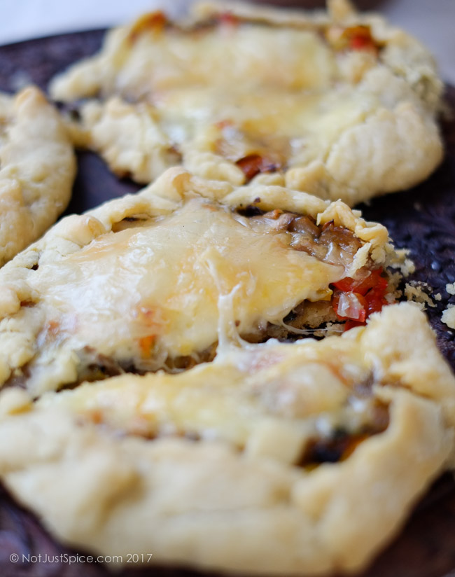 Garlicky Mushroom Cheese Galettes with Caramelised Onions and Peppers on notjustspice.com