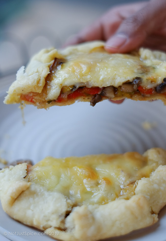 Garlicky Mushroom Cheese Galettes with Caramelised Onions and Peppers on notjustspice.com